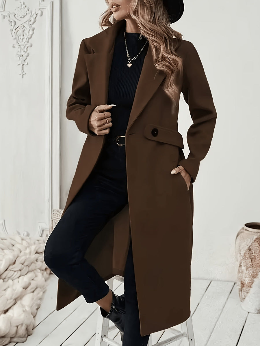 Damkappa med slag och fickor, lång modell i enfärgad design