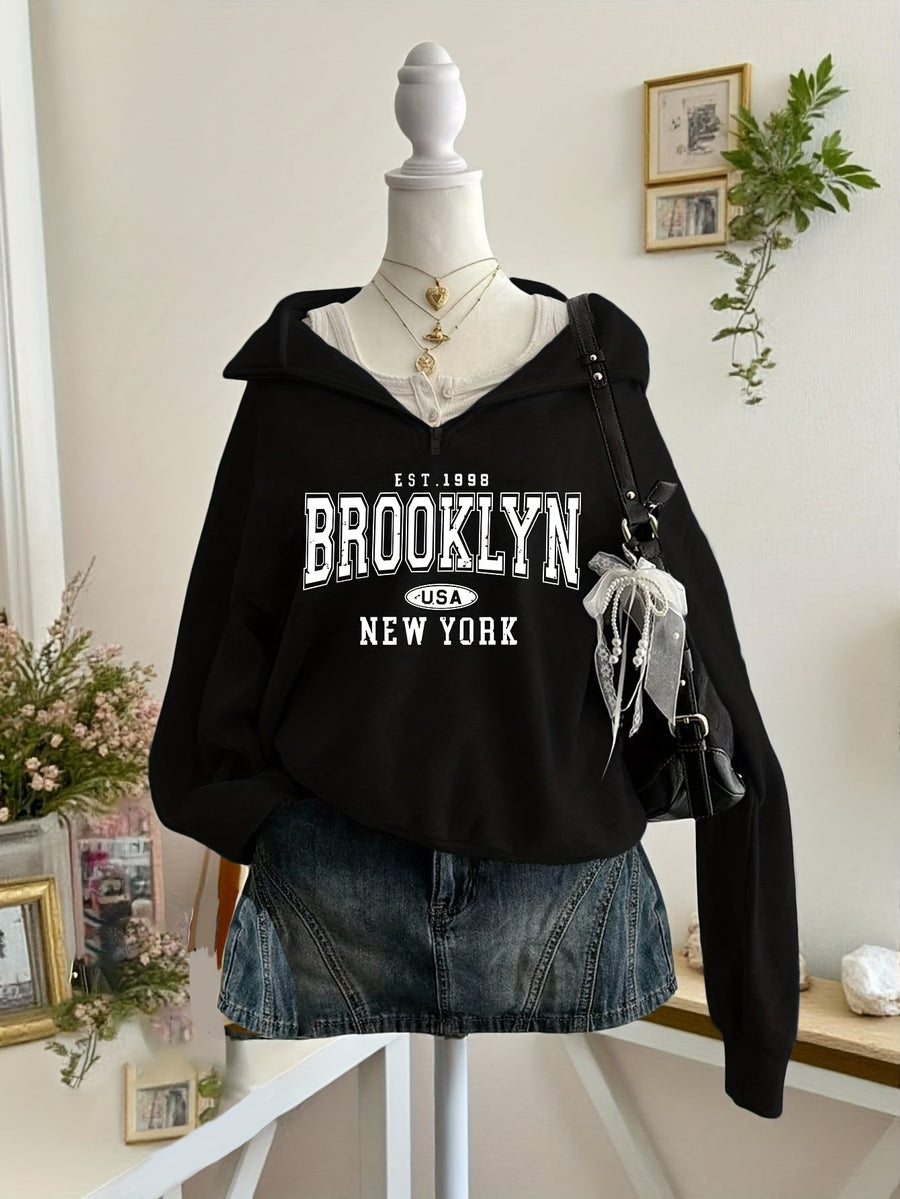 Kort sweatshirt med dragkedja, tryck och halvhög krage i mjukt material
