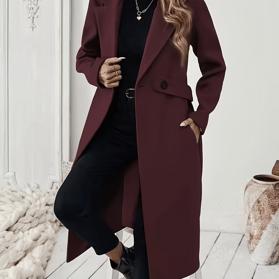 Damkappa med slag och fickor, lång modell i enfärgad design