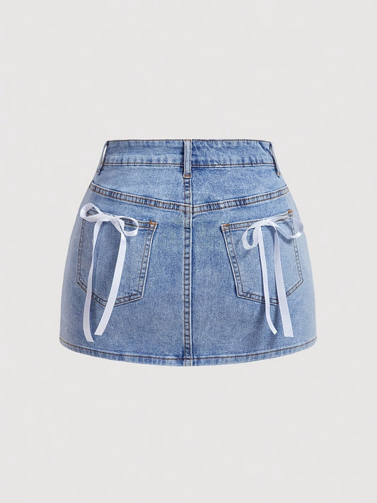 Dam Kjol Mini Elegant Denim Stil för Sommar med Fickdetalj och Dekorativa Rosetter