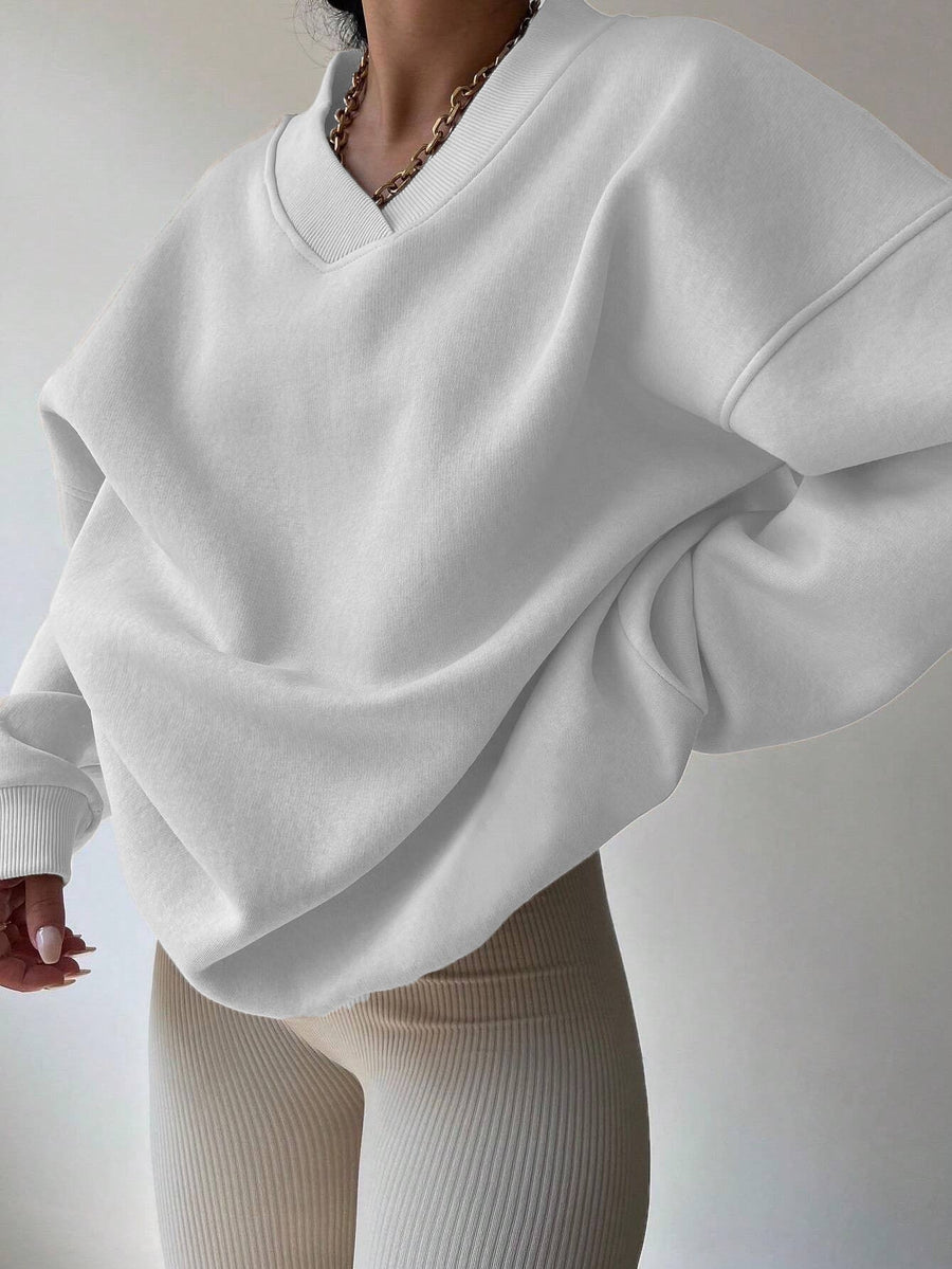 Vit Sweatshirt med V-ringning och Ribbade Detaljer