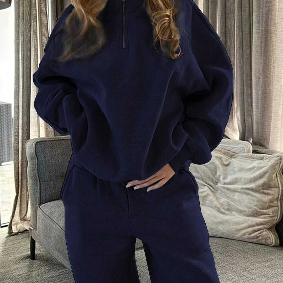 Dam sweatsuit med halv dragkedja, långärmad tröja och matchande byxor i mjukt material