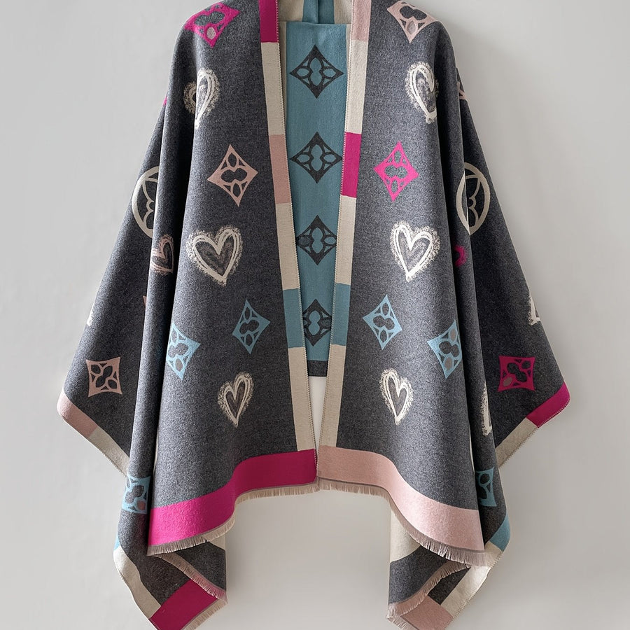 Poncho med mönster och fransar – Svart eller Flerfärgad