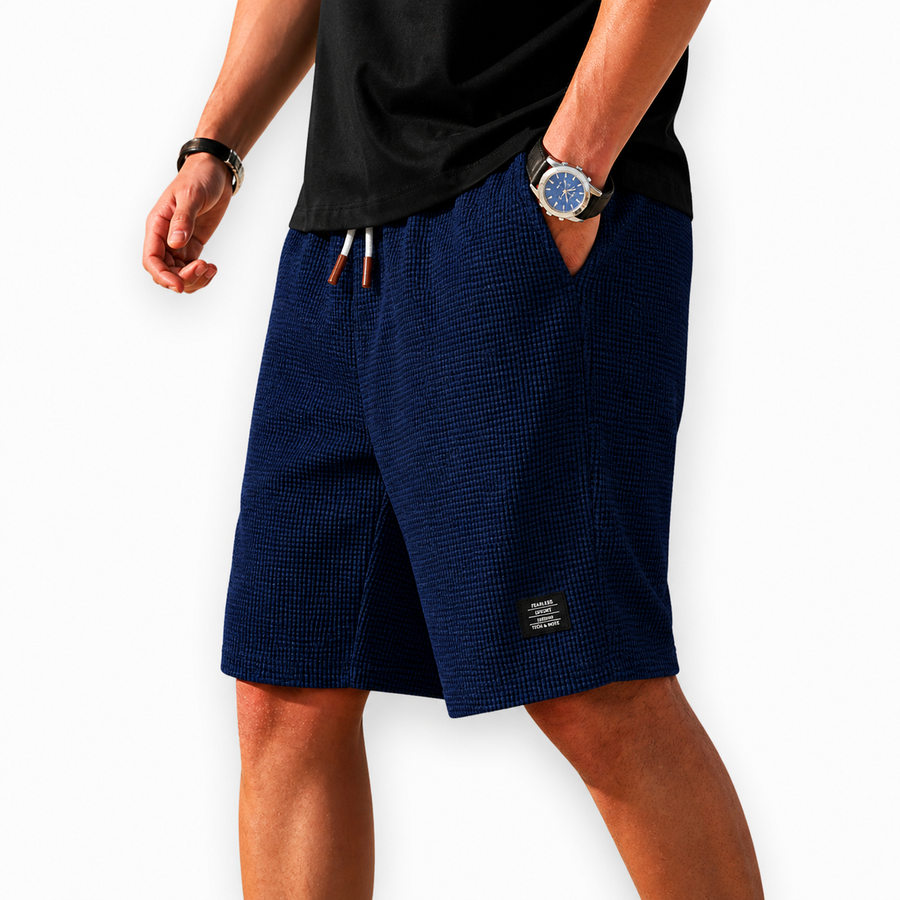 Herrshorts i våffeltyg med dragsko och fickor, enfärgade