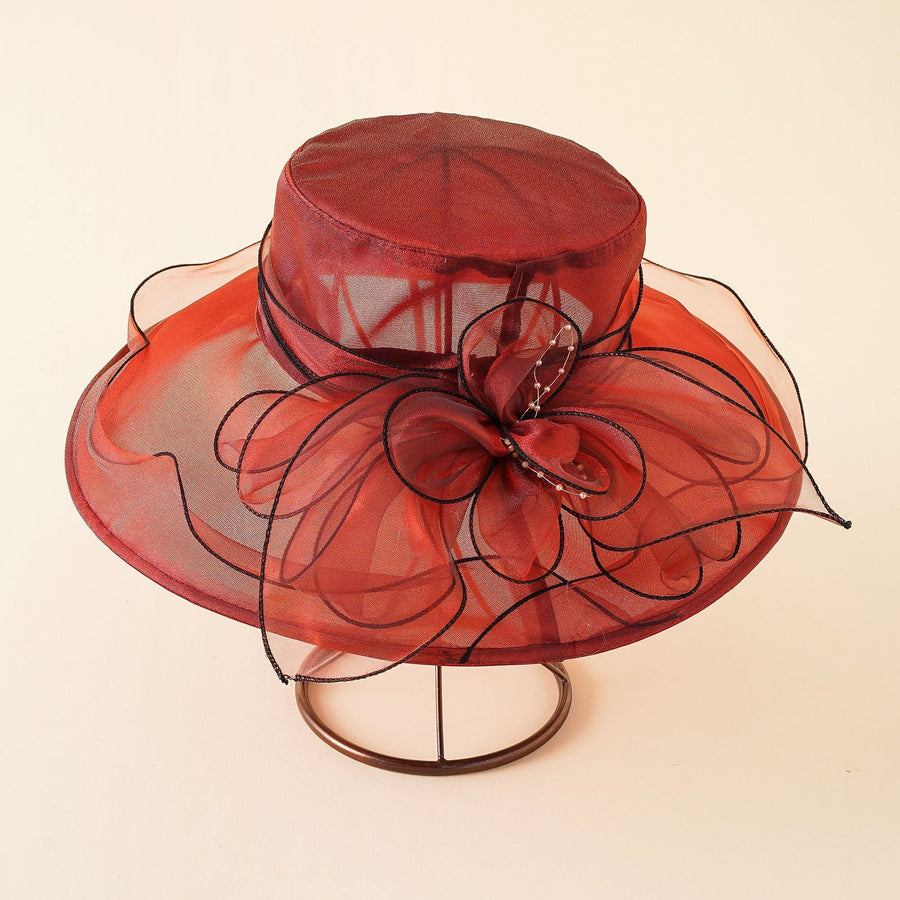 Elegant damhatt med bred brätte och dekorativ rosett, flera färger