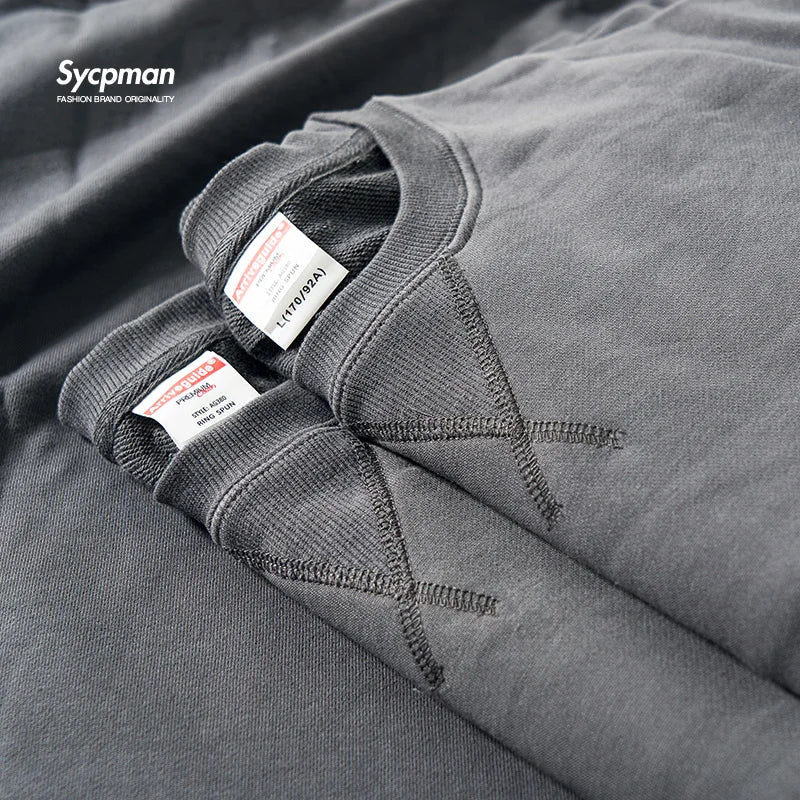 Unisex sweatshirt med rund hals, enfärgad design och ribbade muddar