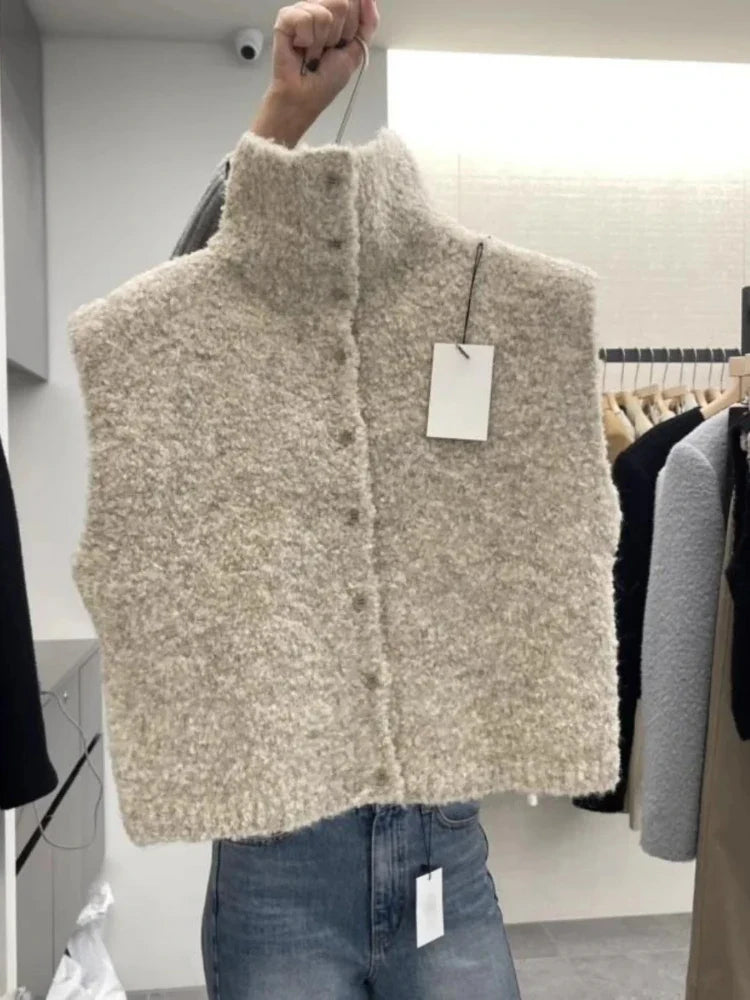 Teddyväst för dam i bouclé med hög krage och knappar