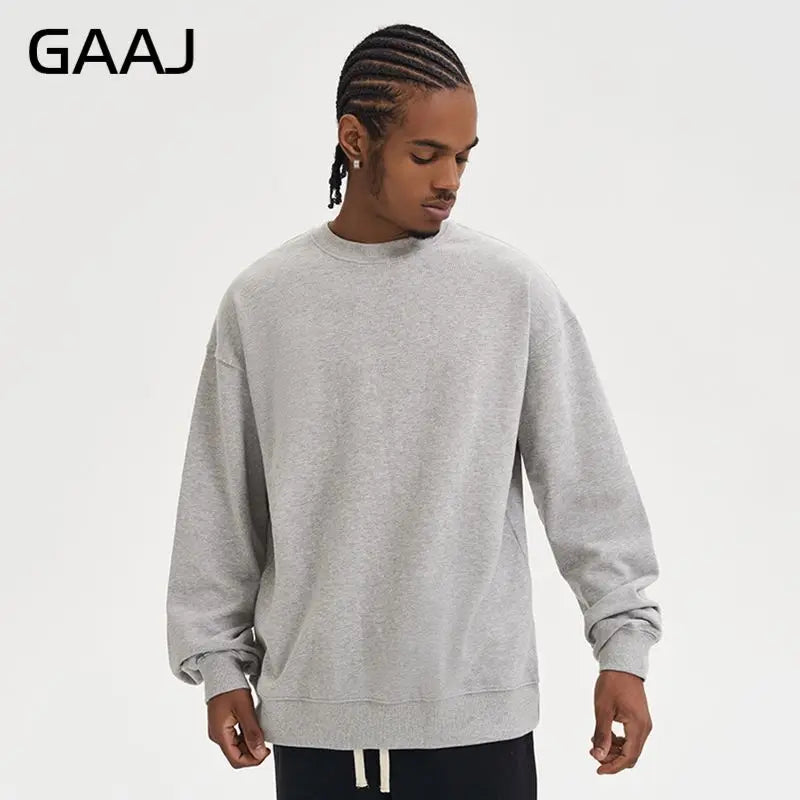 Enkel sweatshirt med rund hals, enfärgad och ribbade muddar
