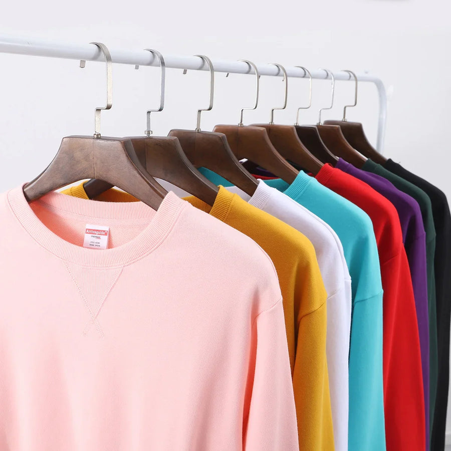 Unisex sweatshirt med rund hals, enfärgad design och ribbade muddar
