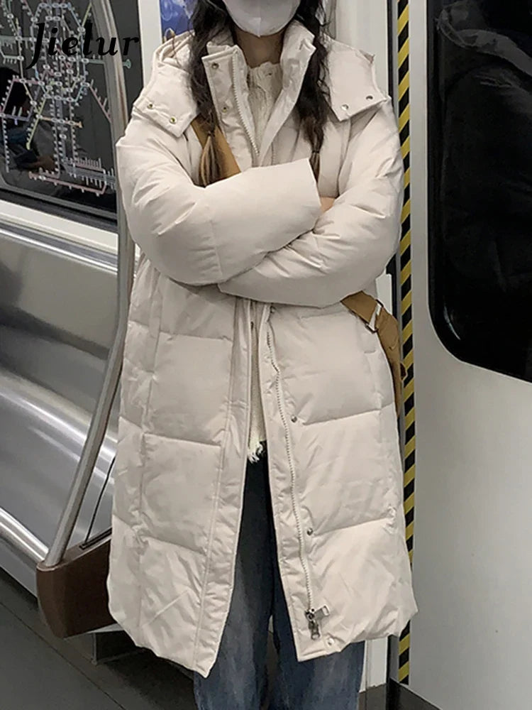 Lång vadderad vinterjacka med huva för dam