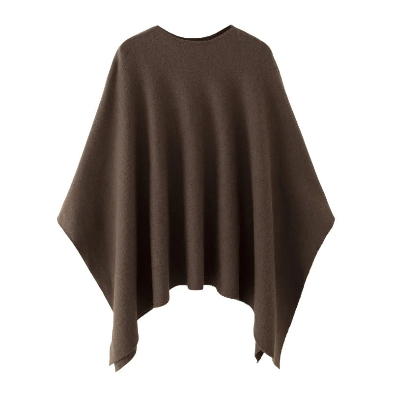 Poncho för dam i enfärgat mjukt material med rund halsringning