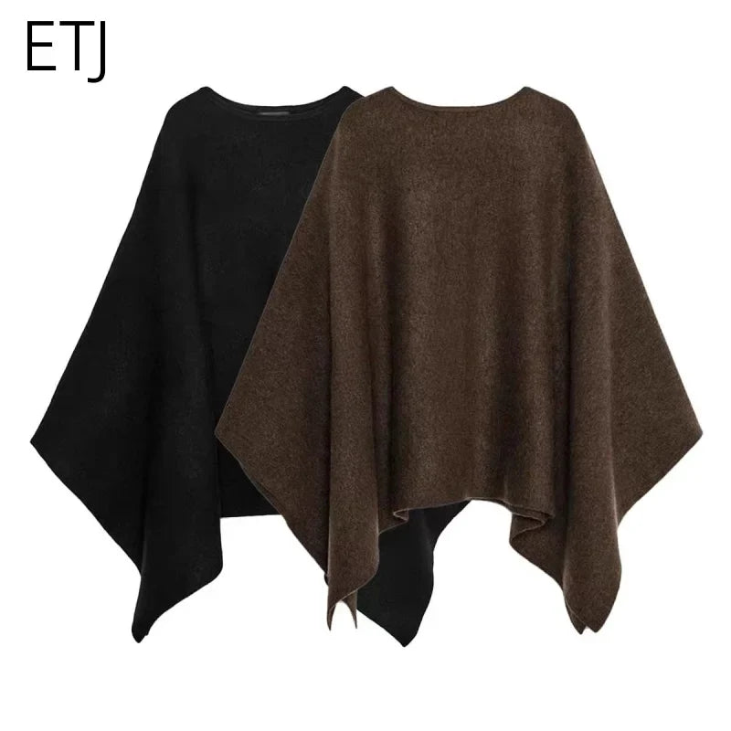 Poncho för dam i enfärgat mjukt material med rund halsringning