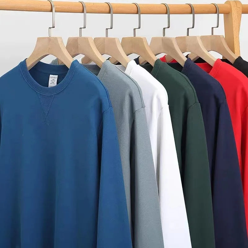 Unisex sweatshirt med rund hals, enfärgad design och ribbade muddar