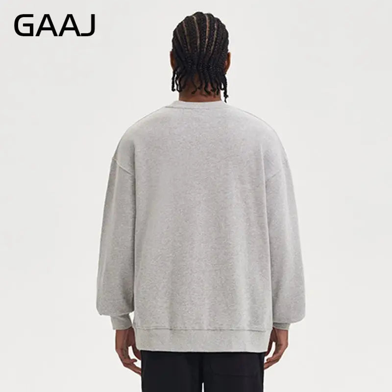 Enkel sweatshirt med rund hals, enfärgad och ribbade muddar