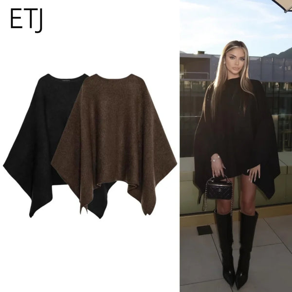 Poncho för dam i enfärgat mjukt material med rund halsringning