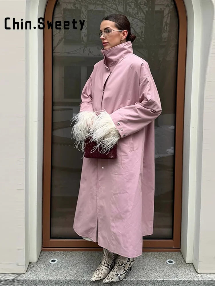 Lång trenchcoat med hög krage och puffärmar för dam