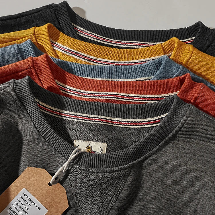 Unisex sweatshirt med rundhalsad krage, ribbade muddar och V-detalj, flera färger
