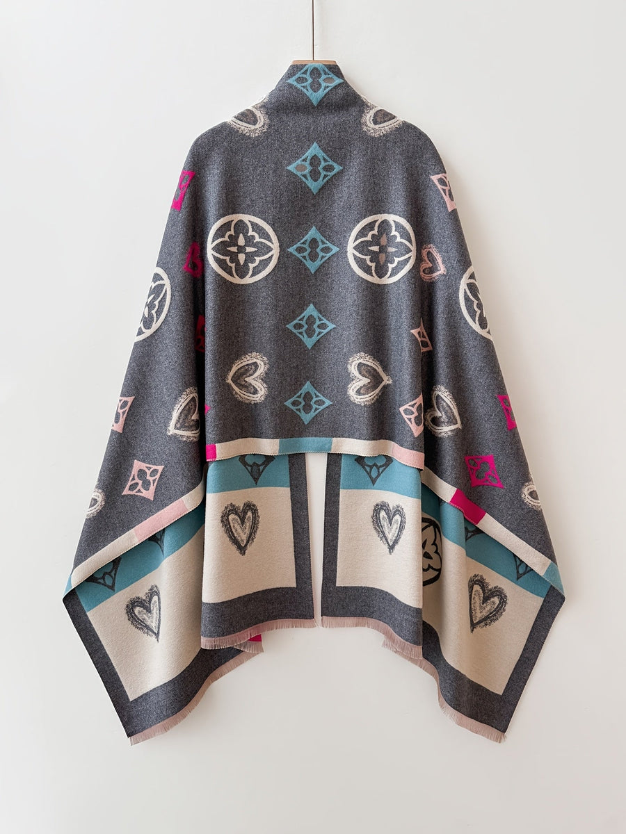 Poncho med mönster och fransar – Svart eller Flerfärgad