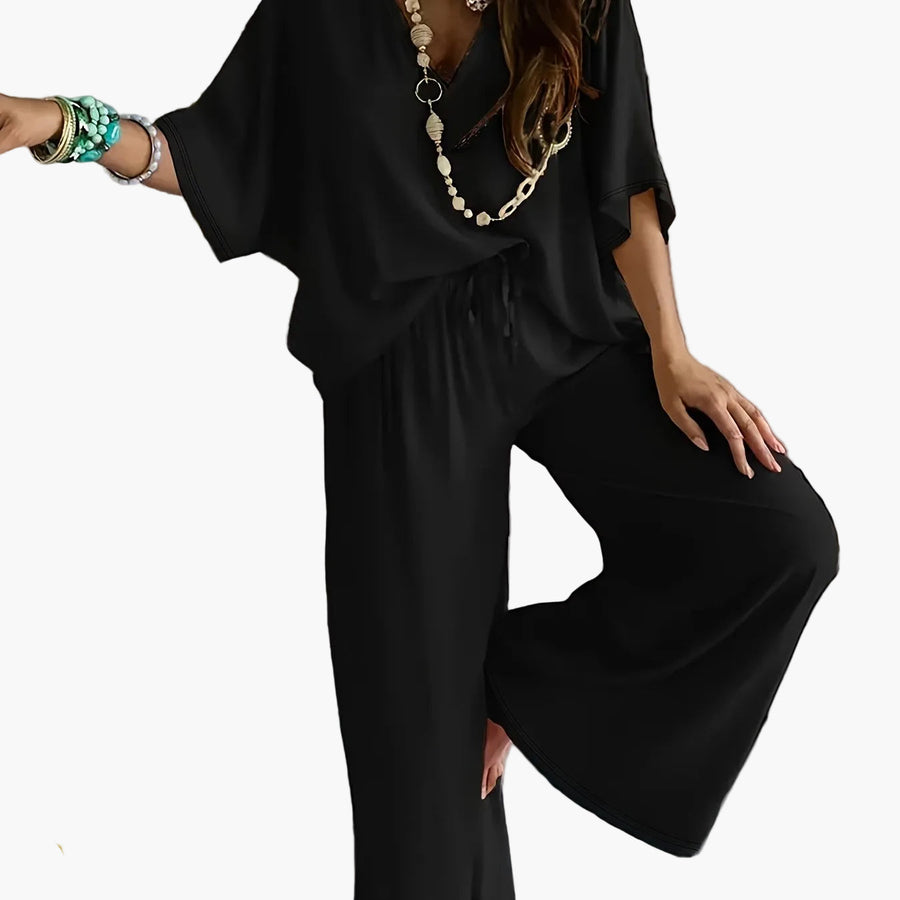 Dam Jumpsuit med V-ringning och Vida Ben – Avslappnad Sommarstil för Fritid och Semester