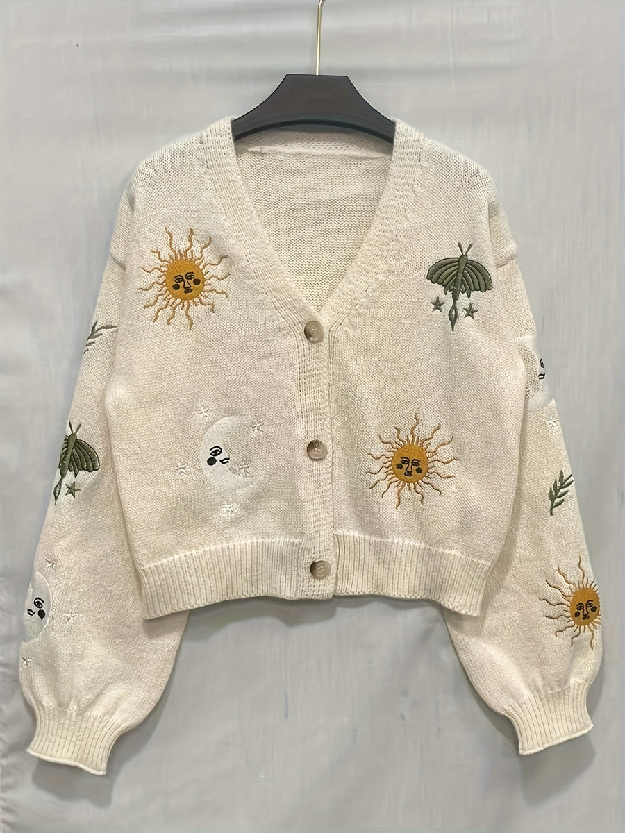 Stickad kofta med V-ringning och broderade sol- och månmotiv, flera färger