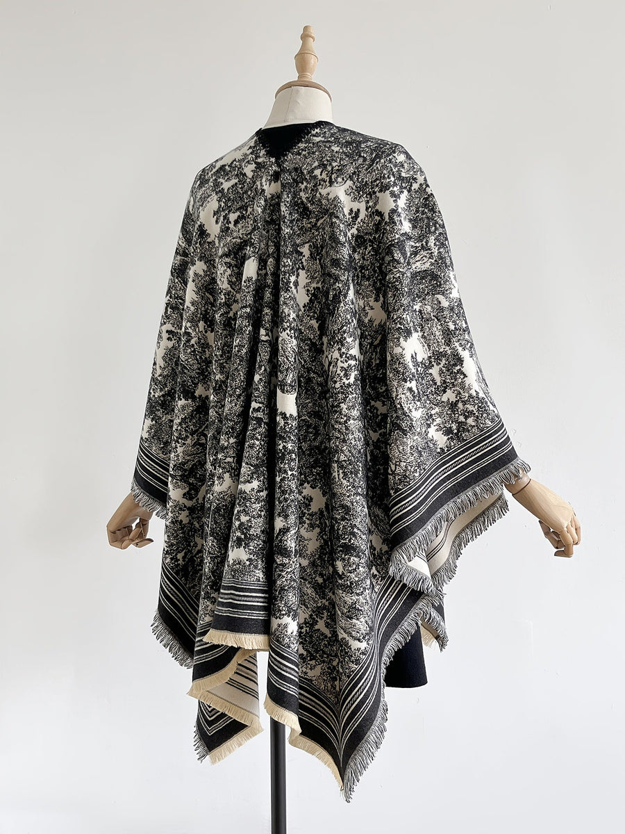 Poncho med mönster och fransar – flera färger