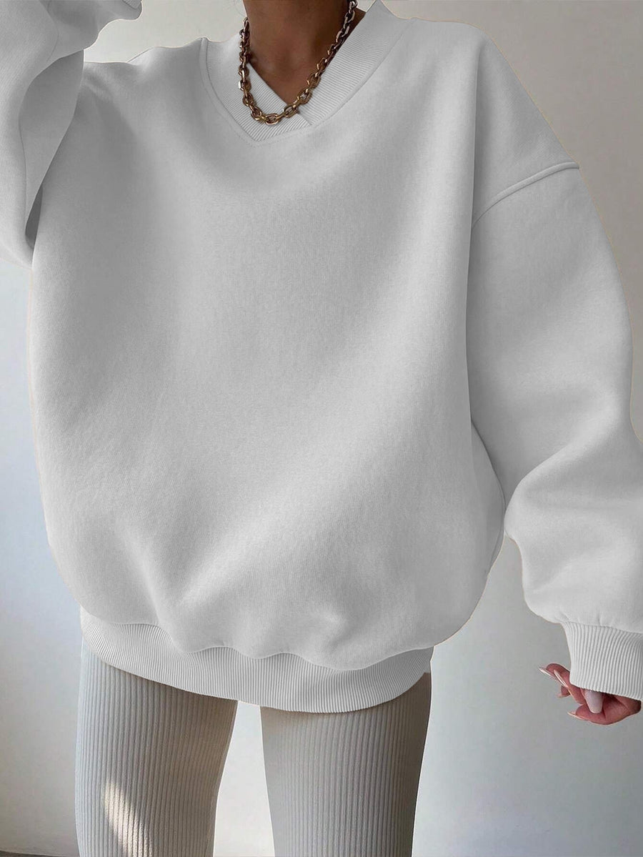 Vit Sweatshirt med V-ringning och Ribbade Detaljer