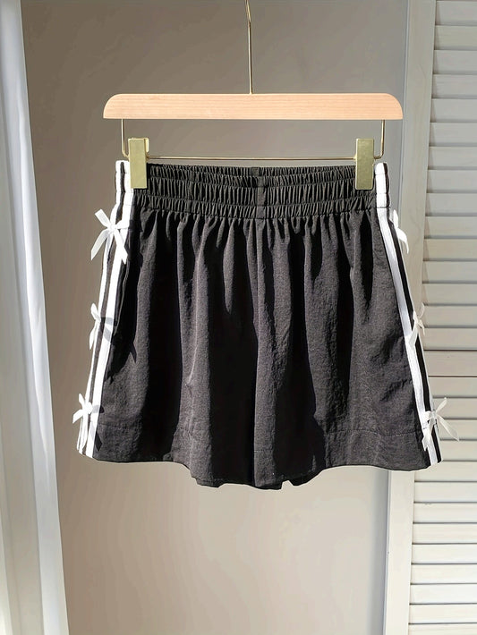 Damshorts med sportig design och dekorativa rosetter – Perfekt för sommar och semester
