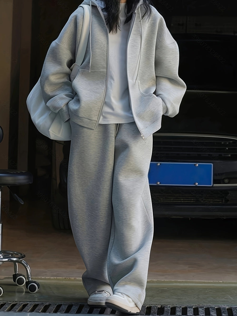 Grå hoodie-set med dragkedja och vida byxor, avslappnad passform