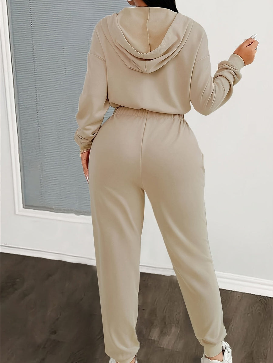 Dam jumpsuit med huva, lång dragkedja och resår i midjan - Beige