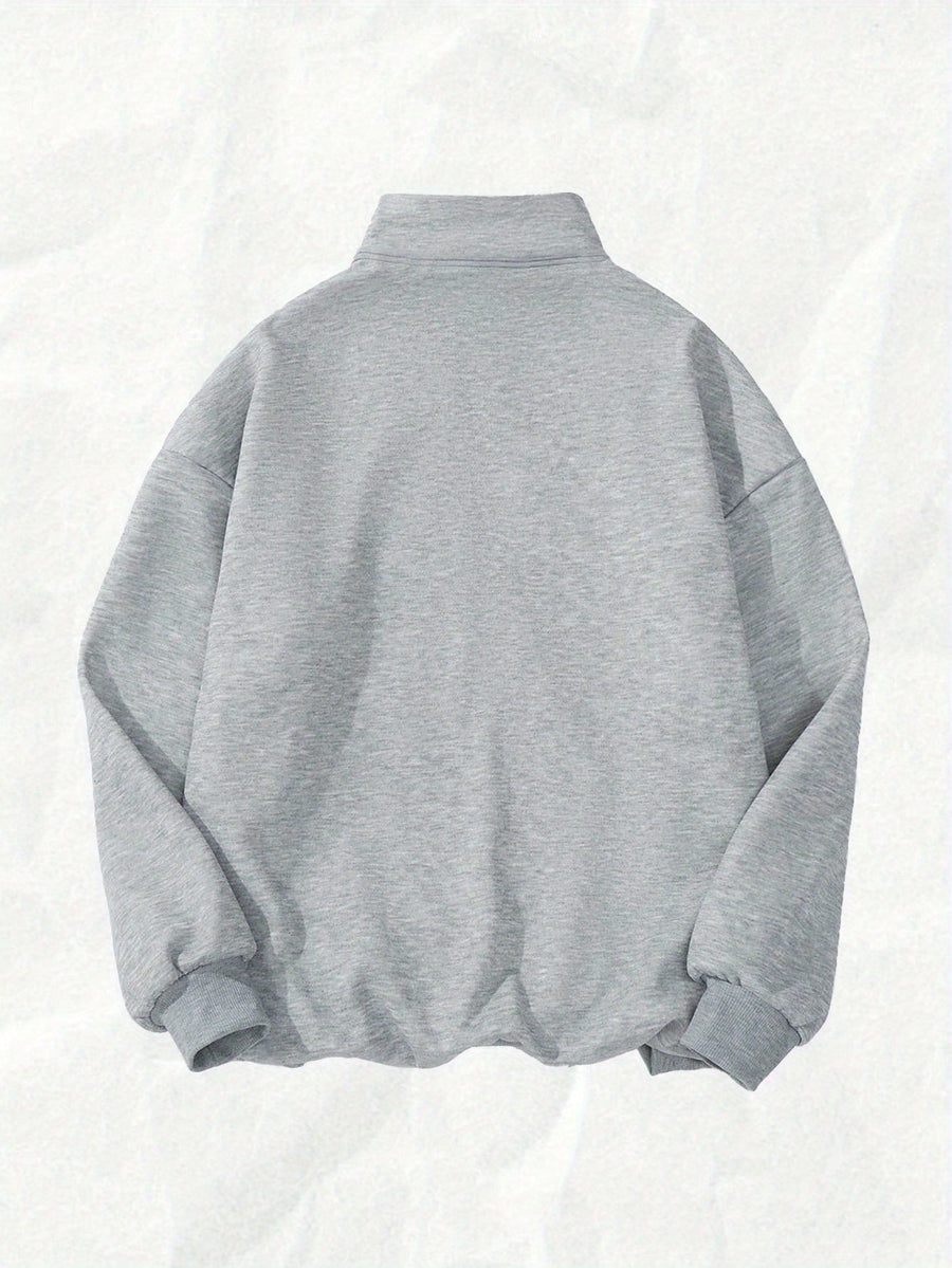 Kort sweatshirt med dragkedja, tryck och halvhög krage i mjukt material