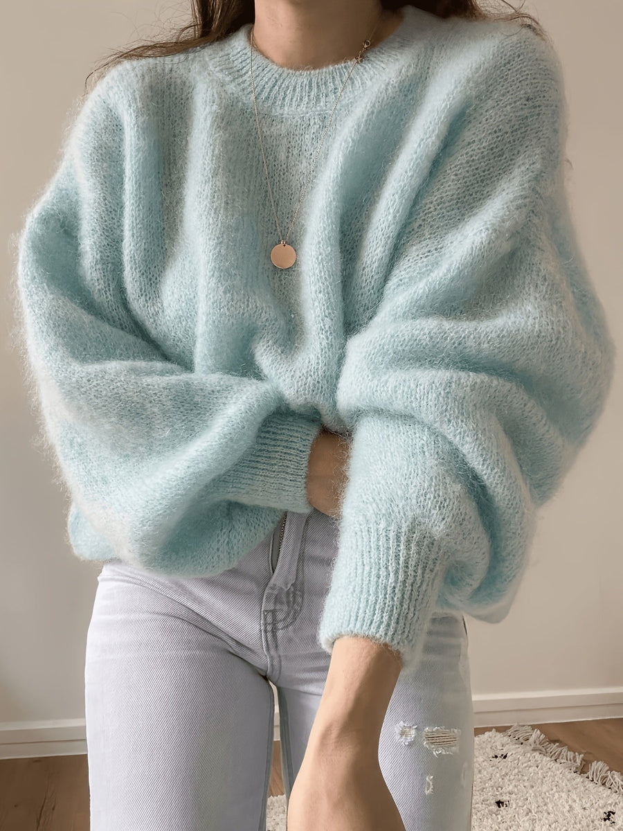 Lösstickad tröja med rund hals och lång ärm - Fluffig design med ribbstickade muddar