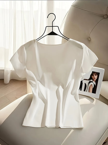 Damblus med rosett och kort ärm – Elegant och feminin topp för kontor och fest