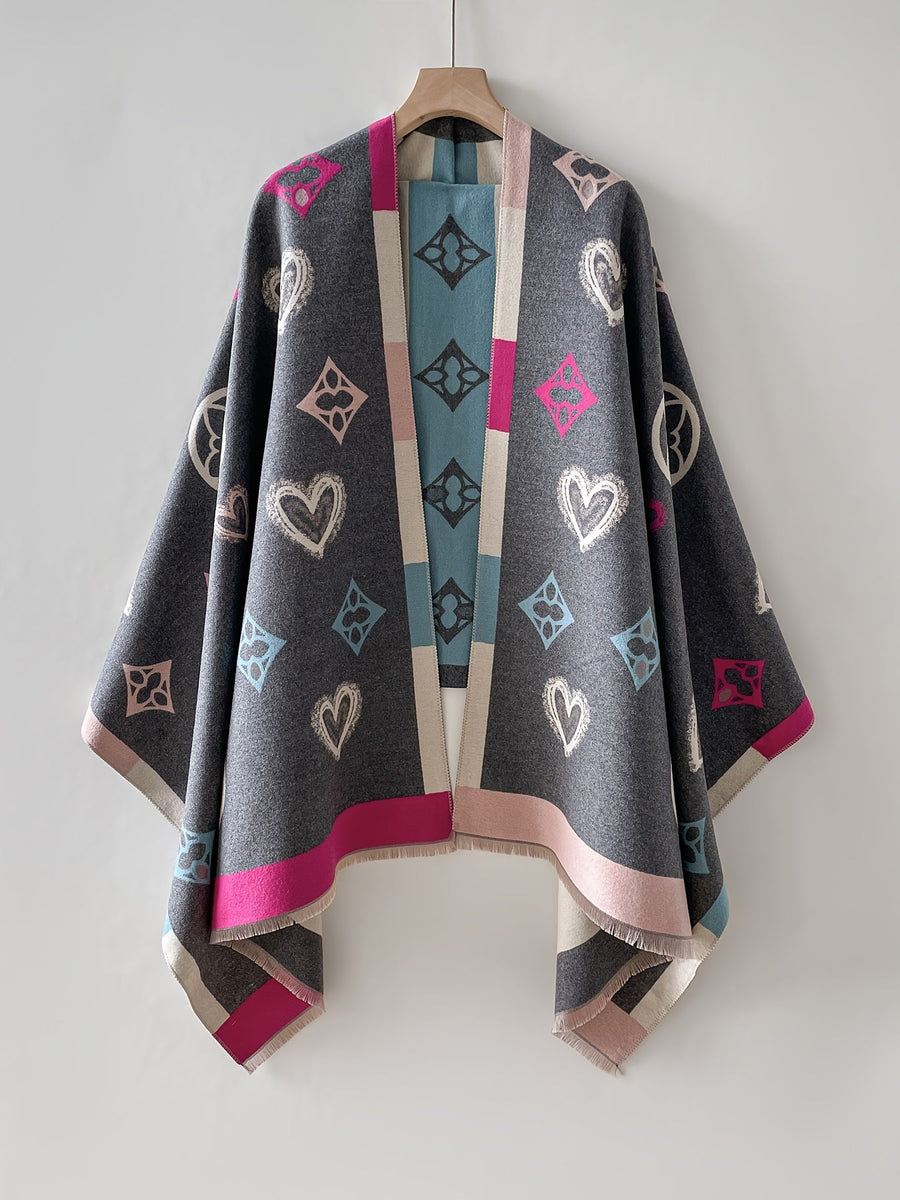 Poncho med mönster och fransar – Svart eller Flerfärgad