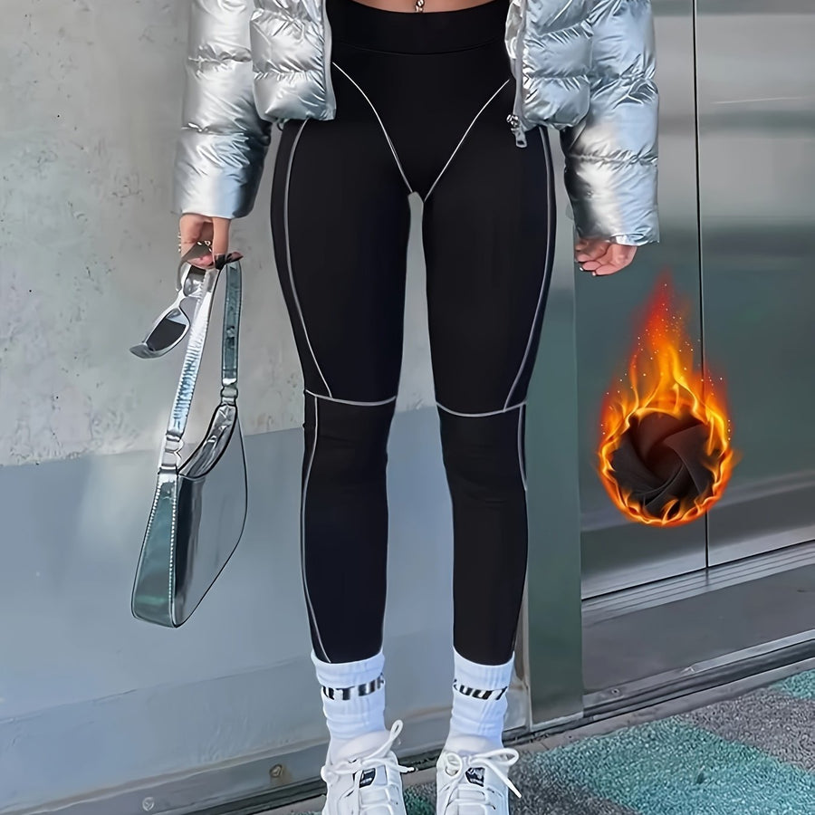 Svarta leggings med kontrasterande sömmar, hög midja