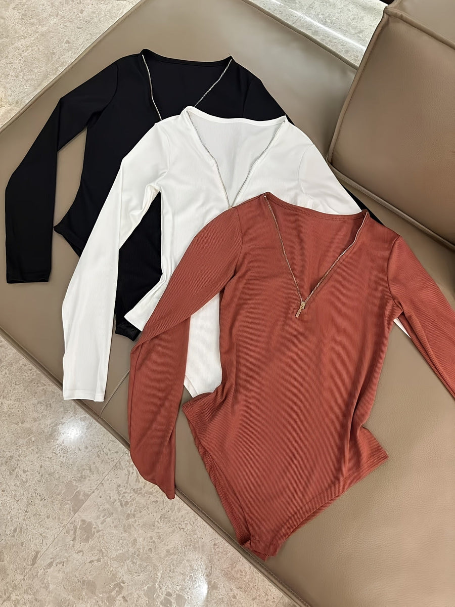 Dam bodysuit med dragkedja i ribbat material och lång ärm, flerfärgad
