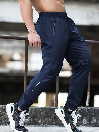 Herrarnas sportiga joggingbyxor för träning och fritid – avslappnad stil med dragkedjefickor
